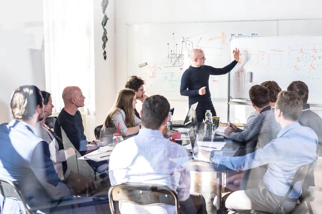 UI and UX designers collaborating on a mobile app development project