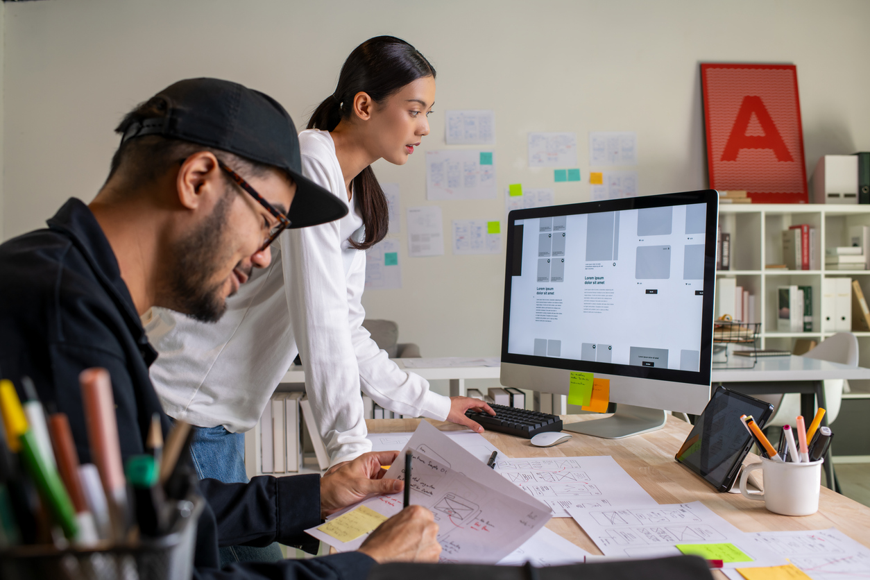 UI UX designers creating a mobile app interface for business users